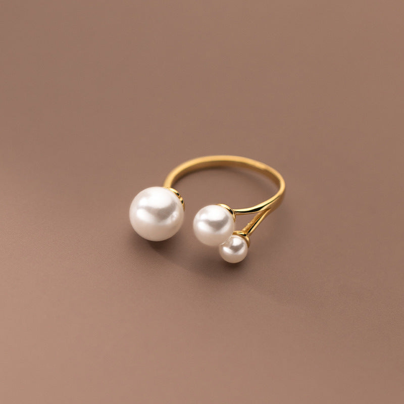 Bague en perles d'eau douce triple ajustable